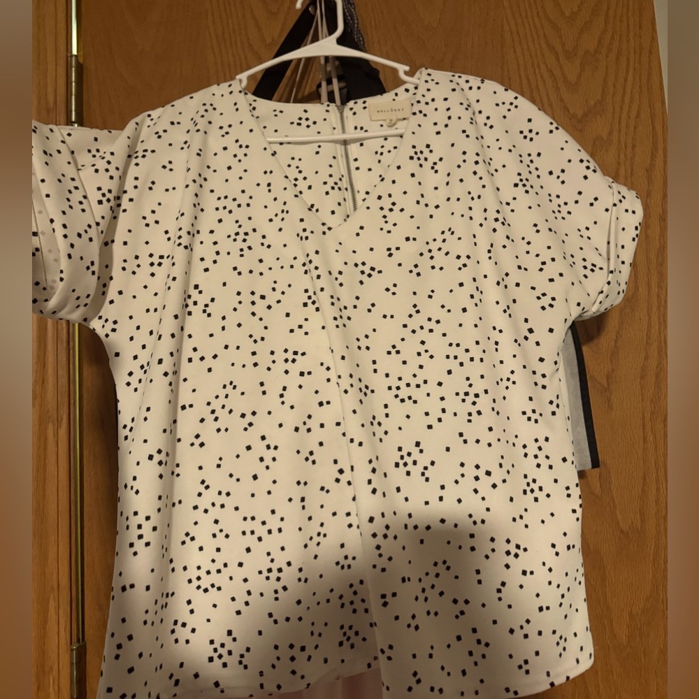 White top with zipper on back, small square pattern, a little bit of stretch